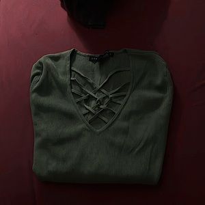 This is a green long sleeve shirt